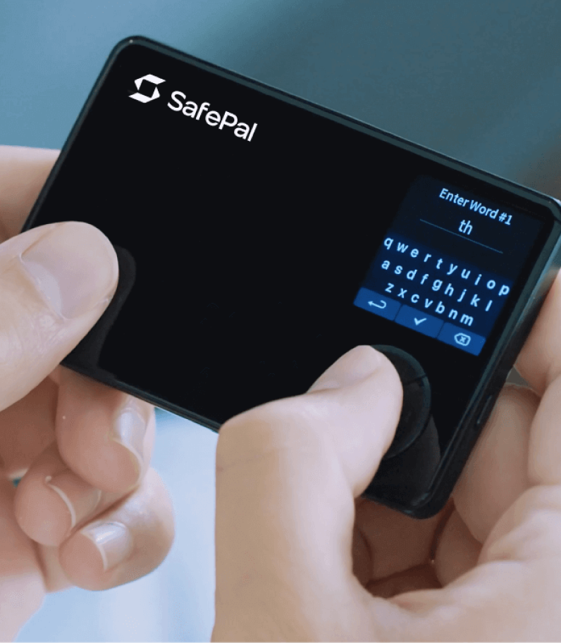 safepal-s1-content-pic6 - Blog Nanovest SafePal hardware wallet held in hands with a small on-device keyboard visible on the screen's right side